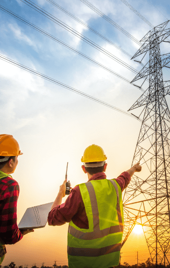 picture-two-electrical-engineers-checking-electrical-work-using-computer-standing-power-station-see-planning-work-high-voltage-electrodes@2x