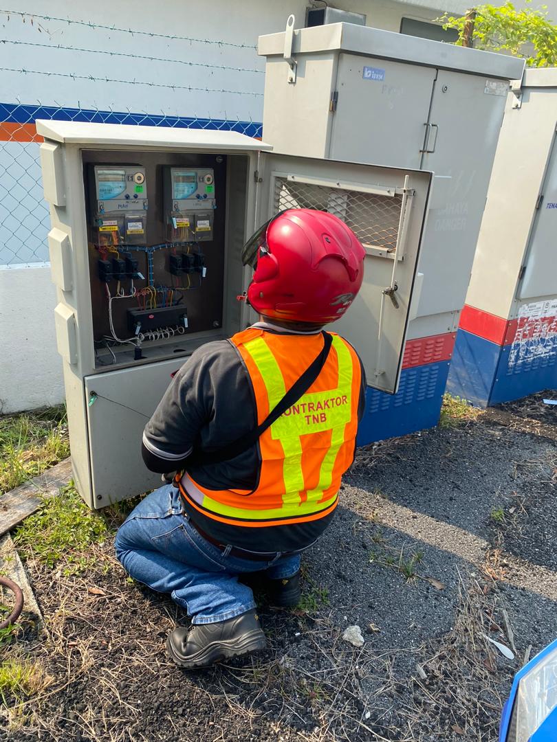 A man collecting data & images of Feeder pillar box