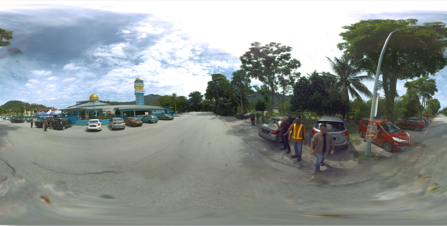 panoramic image of a street there is a mosque in the image